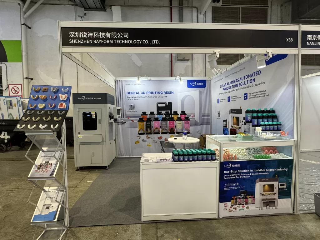 Rayform Technology exhibition booth displaying dental 3D printing resins and equipment at DenTech China 2025 in Shanghai.