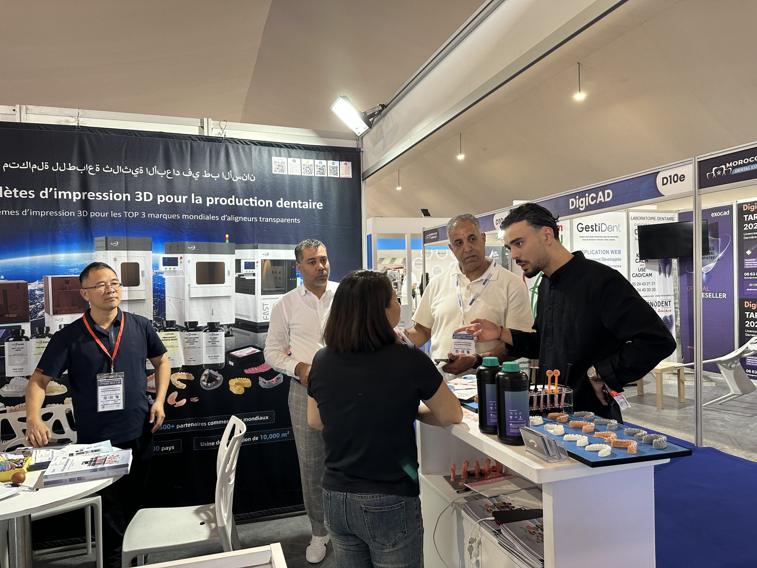 RayForm team discussing dental 3D printing with visitors at Stand C10a, Morocco Dental Expo 2026