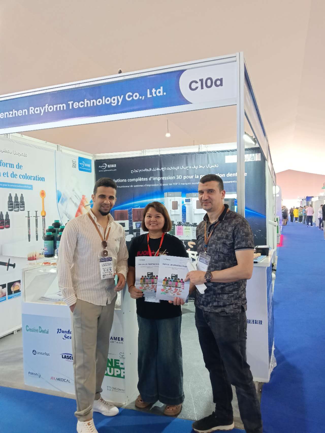 RayForm staff with a customer at Stand C10a during Morocco Dental Expo 2026 in Casablanca